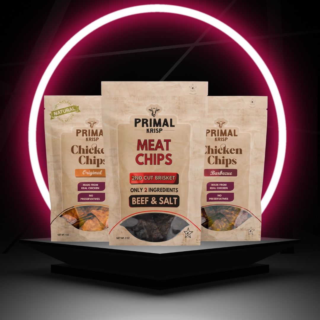Primal Krisp meat snacks stacked in a to-go bag with protein label visible